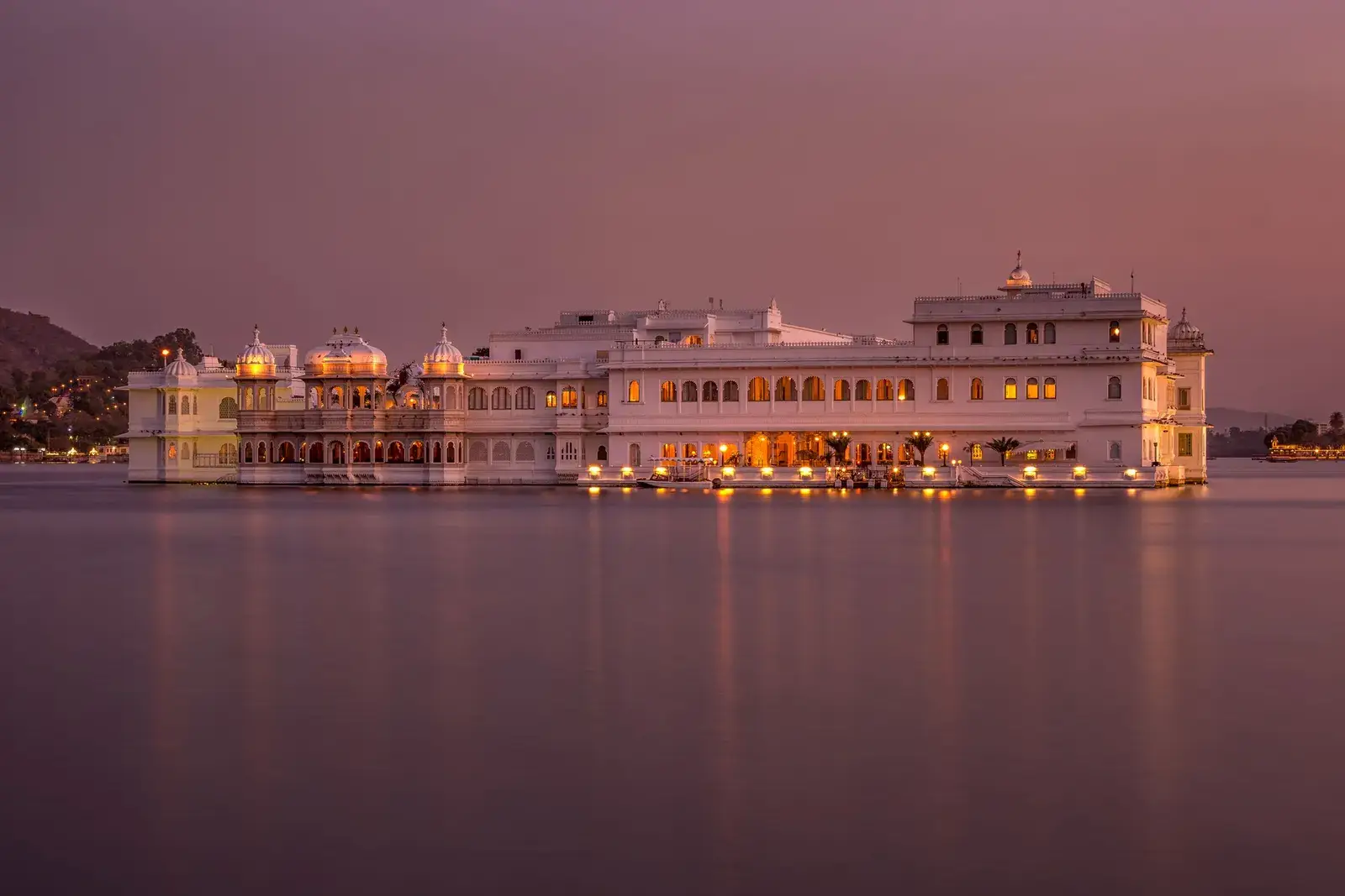 The Lake Palace on Lake Pichola, Udaipur, lit up at twilight