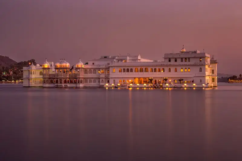 The Lake Palace on Lake Pichola, Udaipur, lit up at twilight
