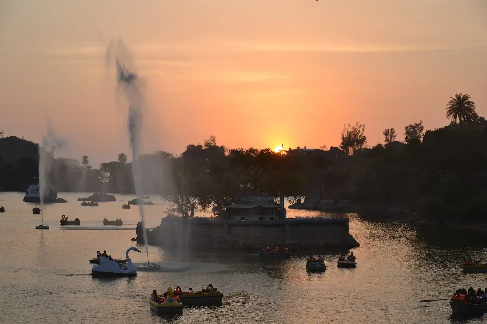 Nakki Lake in Mount Abu at sunset, with boats on the water