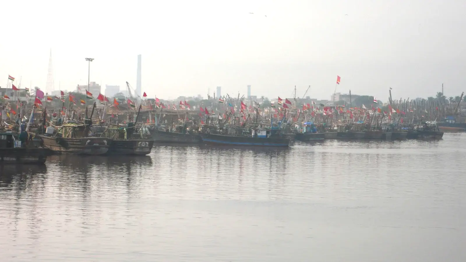 Fishing boats moored side by side in Veraval harbour